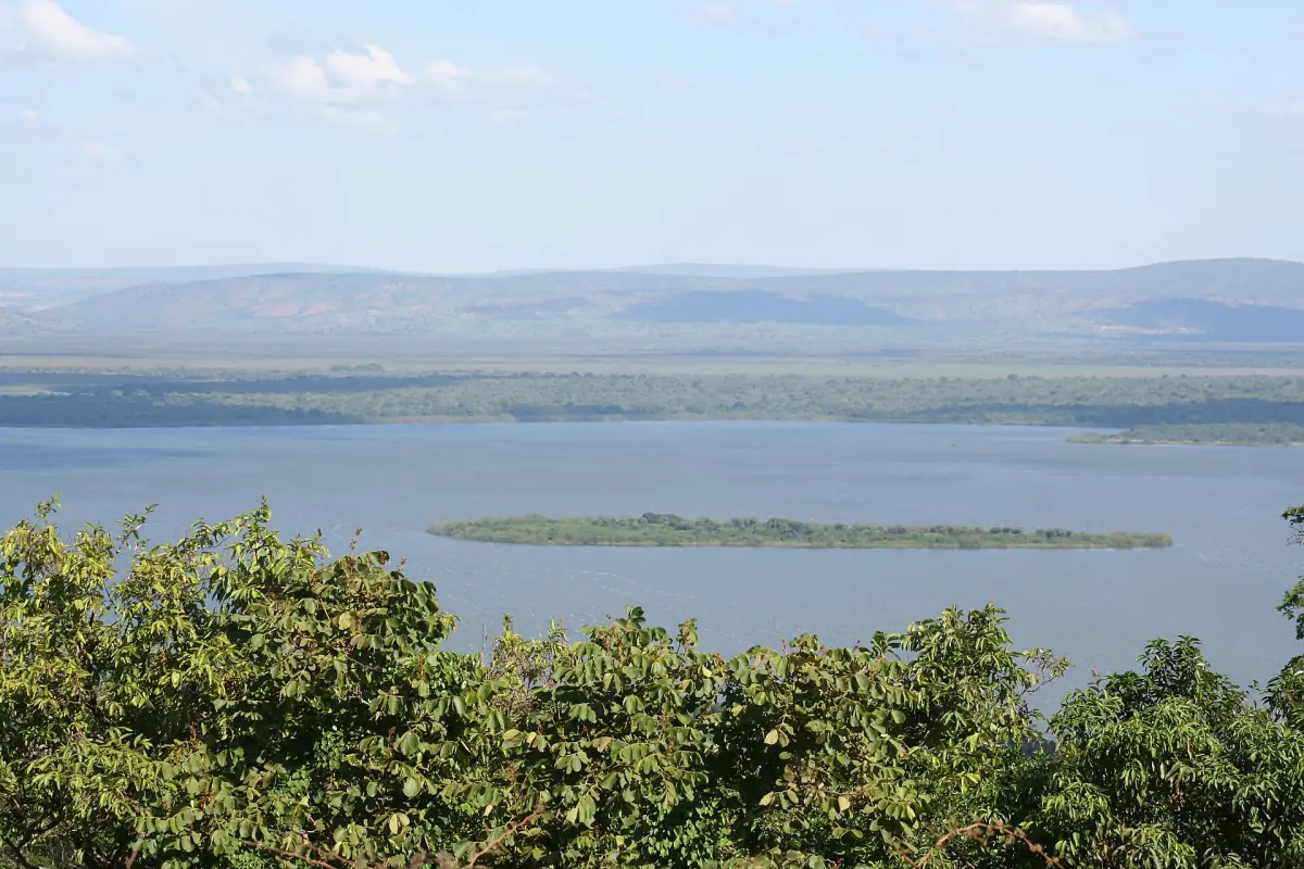 View over Lake Ihema with a small island and distant hills